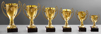 Thumbnail for Eine Sammlung der goldenen POMEKI Pokale Brandenburg 6-er Pokalserie in verschiedenen Größen, absteigend sortiert.